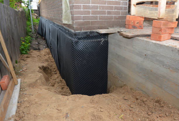 SJ Waterproofing Pros technician performing targeted Wet Basement Repair assessment in Paulding, OH